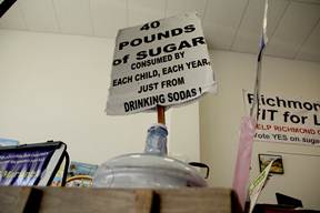 A 40-pound bag of sugar sits in a red wagon.
